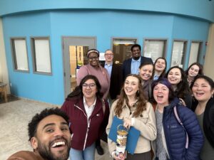 Image of 12 advocates inside the state capitol building in Olympia, Washington, including COO Sunny Wonder and Nneka D. Coxeff. CFTH staff and partners advocating for homelessness solutions for youth.